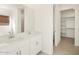 Bathroom boasts double vanity and walk-in closet at 37517 W San Clemente St, Maricopa, AZ 85138