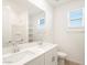 Bathroom with double vanity, large mirror, and shower/tub combo at 37517 W San Clemente St, Maricopa, AZ 85138
