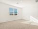 Spacious bedroom with neutral carpeting and window at 37517 W San Clemente St, Maricopa, AZ 85138