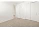 Spacious bedroom with double door closet and neutral carpet at 37517 W San Clemente St, Maricopa, AZ 85138
