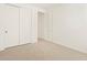 Well-lit bedroom with double door closet and neutral carpet at 37517 W San Clemente St, Maricopa, AZ 85138