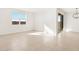 Bright dining area with tile floors and access to backyard at 37517 W San Clemente St, Maricopa, AZ 85138