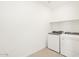 Laundry room with washer and dryer included at 37517 W San Clemente St, Maricopa, AZ 85138