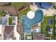 Aerial view of a luxury home with a large, unique pool, spa, and expansive backyard at 21423 S 147Th St, Gilbert, AZ 85298