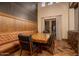 Rustic dining area with wood table and leather bench at 21423 S 147Th St, Gilbert, AZ 85298