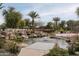 Serene pond with a bridge and lush landscaping at 21423 S 147Th St, Gilbert, AZ 85298