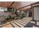 Landscaped backyard with a pergola and stone pathway at 21423 S 147Th St, Gilbert, AZ 85298