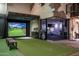 Indoor golf simulator and fitness area; perfect for recreation at 21423 S 147Th St, Gilbert, AZ 85298