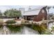 Barn-style home with pond and landscaping at 21423 S 147Th St, Gilbert, AZ 85298