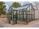 Spacious greenhouse with glass walls and stone base at 21423 S 147Th St, Gilbert, AZ 85298