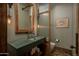 Modern bathroom with concrete sink and wood accents at 21423 S 147Th St, Gilbert, AZ 85298
