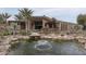 Landscaped backyard with pond and fountain at 21423 S 147Th St, Gilbert, AZ 85298