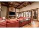 Relaxing living room with a fireplace and large windows offering pool views at 21423 S 147Th St, Gilbert, AZ 85298