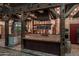 Rustic kitchen with large island, exposed beams, and farmhouse sink at 21423 S 147Th St, Gilbert, AZ 85298