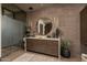 Modern bathroom with a floating vanity and brick walls at 21423 S 147Th St, Gilbert, AZ 85298