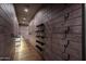 Long gun room with shelves, hooks, and ample storage at 21423 S 147Th St, Gilbert, AZ 85298