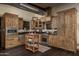 Rustic kitchen with wooden cabinets and modern appliances at 21423 S 147Th St, Gilbert, AZ 85298