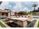 Modern hot tub with fire feature and seating at 21423 S 147Th St, Gilbert, AZ 85298