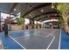 Covered outdoor basketball court with seating and scoreboard at 21423 S 147Th St, Gilbert, AZ 85298