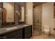 Elegant bathroom with a glass shower and double vanity at 21423 S 147Th St, Gilbert, AZ 85298