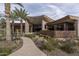Luxury home exterior with desert landscaping and walkway at 21423 S 147Th St, Gilbert, AZ 85298