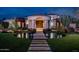 Stunning curb appeal with a circular water feature at 21423 S 147Th St, Gilbert, AZ 85298
