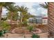 Landscaped garden with greenhouse and tiered seating at 21423 S 147Th St, Gilbert, AZ 85298