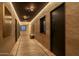 Long hallway with wood flooring, artwork, and a bench at 21423 S 147Th St, Gilbert, AZ 85298