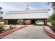 Barn-style garage with a long driveway and landscaping at 21423 S 147Th St, Gilbert, AZ 85298