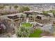 Modern home with circular pond and lush landscaping at 21423 S 147Th St, Gilbert, AZ 85298