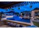 Resort-style pool with pergola, swim-up bar, and lounge chairs at 21423 S 147Th St, Gilbert, AZ 85298