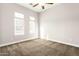 Bright bedroom with neutral walls and carpet flooring at 5309 N 148Th Ave, Litchfield Park, AZ 85340