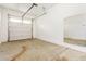 Spacious garage with overhead door and large mirror at 5309 N 148Th Ave, Litchfield Park, AZ 85340
