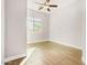 Spacious bedroom with tile floor and ceiling fan at 5309 N 148Th Ave, Litchfield Park, AZ 85340