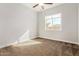 Well-lit bedroom with carpet and a window at 5309 N 148Th Ave, Litchfield Park, AZ 85340