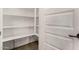 Well-lit pantry with ample shelving for storage at 5309 N 148Th Ave, Litchfield Park, AZ 85340