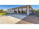Large backyard with gravel and concrete patio at 5309 N 148Th Ave, Litchfield Park, AZ 85340