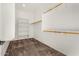 Large walk-in closet with shelving and hanging rods at 5309 N 148Th Ave, Litchfield Park, AZ 85340