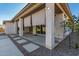 Covered patio with stone pathway and desert landscaping at 5309 N 148Th Ave, Litchfield Park, AZ 85340
