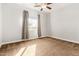 Well-lit bedroom with window, carpet, and ceiling fan at 5309 N 148Th Ave, Litchfield Park, AZ 85340