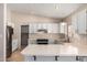 Modern kitchen featuring stainless steel appliances and ample counter space at 6034 E Hillview St, Mesa, AZ 85205