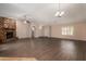 Open living room with a stone fireplace and high ceilings at 6034 E Hillview St, Mesa, AZ 85205