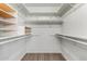 Spacious walk-in closet with ample shelving and hanging space at 6034 E Hillview St, Mesa, AZ 85205