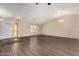 Spacious living room with high ceilings and wood-look flooring at 6034 E Hillview St, Mesa, AZ 85205