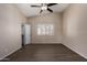 Bedroom with wood-look floors, ceiling fan and window at 6034 E Hillview St, Mesa, AZ 85205