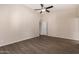 Spacious bedroom with wood-look floors and ceiling fan at 6034 E Hillview St, Mesa, AZ 85205