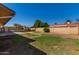Large backyard with grassy area and block wall at 6034 E Hillview St, Mesa, AZ 85205