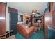 Cozy media room featuring a leather couch and built-in shelving at 3002 W Latham St, Phoenix, AZ 85009