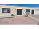 House exterior featuring a gated entry and a two-car garage at 3002 W Latham St, Phoenix, AZ 85009