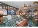 Living room with patterned sofa, coffee table, and lots of wall decor at 3002 W Latham St, Phoenix, AZ 85009